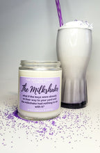 Load image into Gallery viewer, The Milkshake candle has a pastel purple label and is standing beside a milkshake with whipped cream and a purple straw. There is matching purple sprinkles surrounding everything.