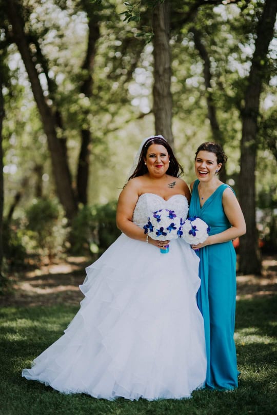 The picture is of a bride and her maid of honor laughing at something funny. The picture is of the owners as it is a sister owned business. 